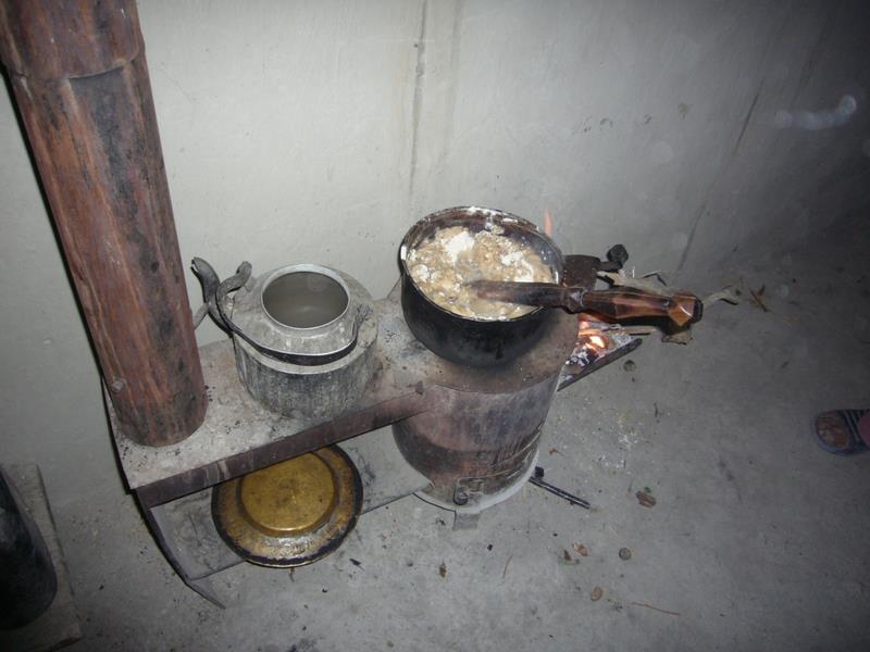 Tsompa cooking for the grandparents.